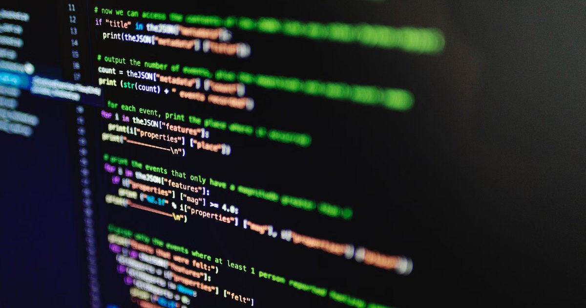 Close-up of software code on a dark screen with shallow depth of field
